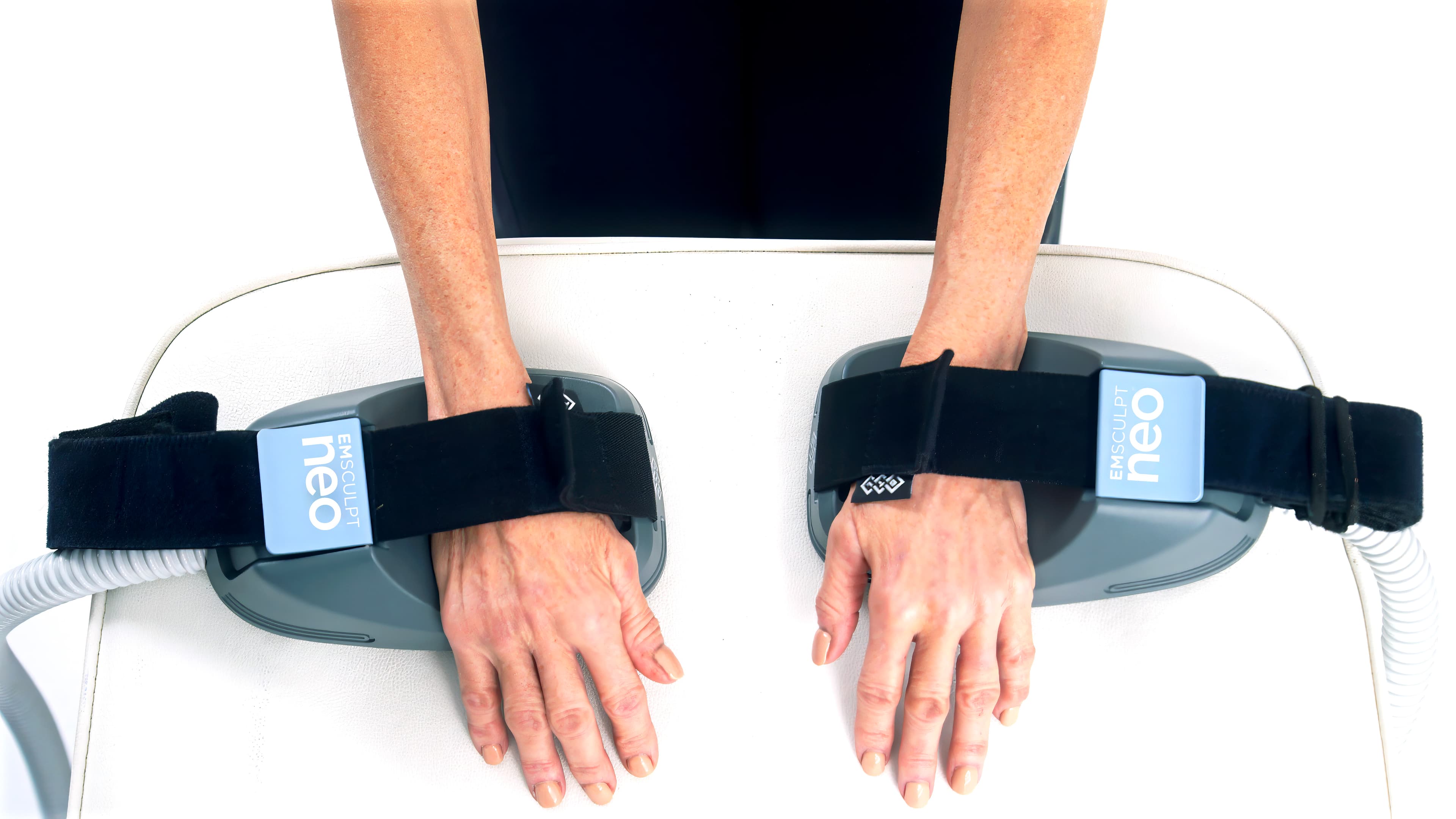 EMSculpt Neo small applicators on the forearms