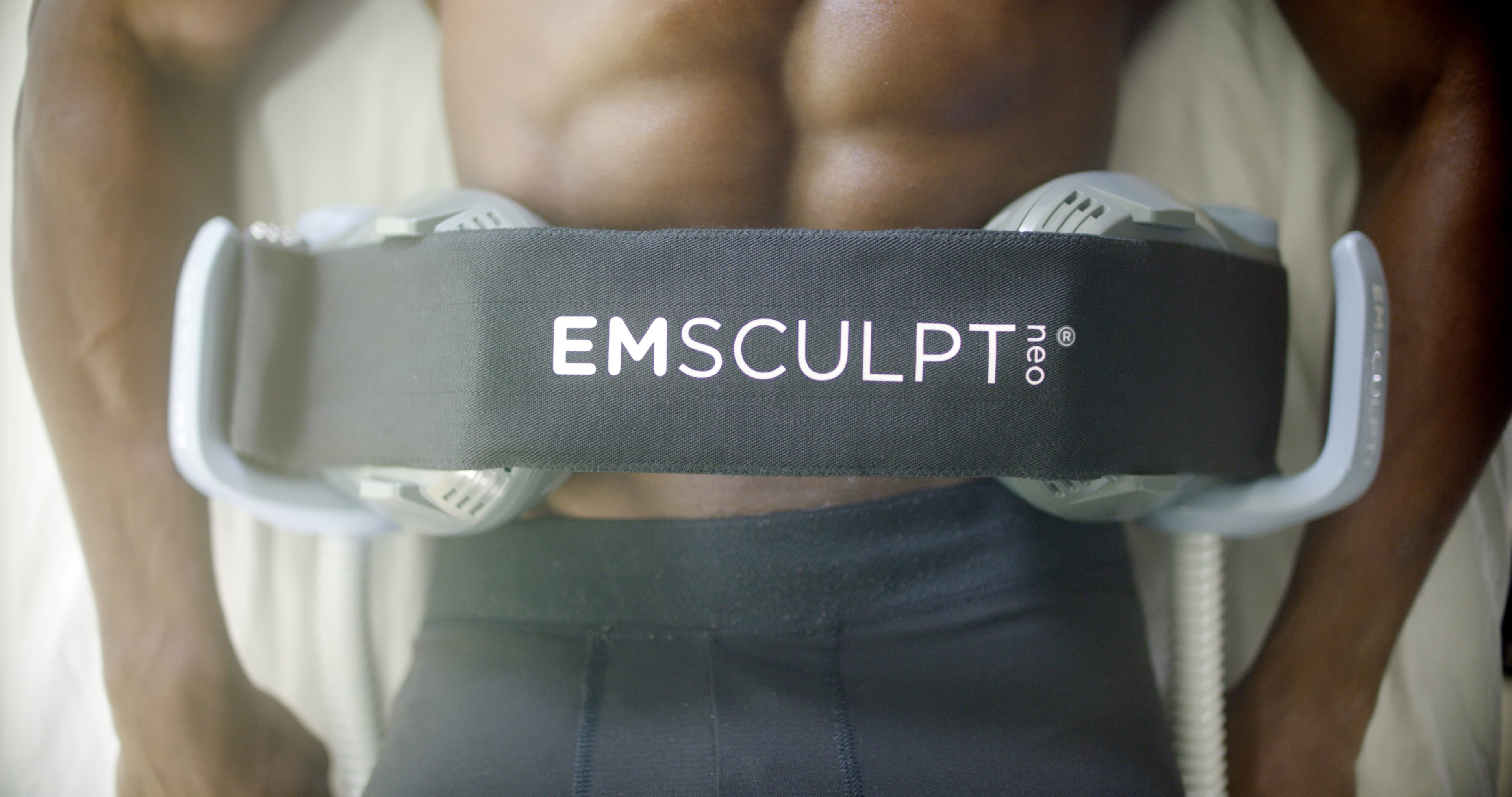 EMSculpt Neo large applicator on the abdomen